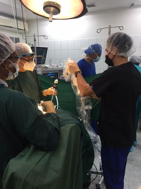 Surgeon and surgical team setting up for robotic assisted hysterectomy